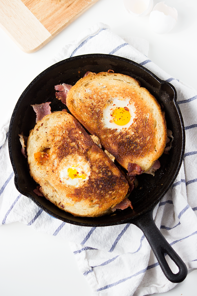 This recipe for Bacon Cheddar Grilled Cheese Egg in a Hole was so good that my boyfriend proposed to me - no joke! 