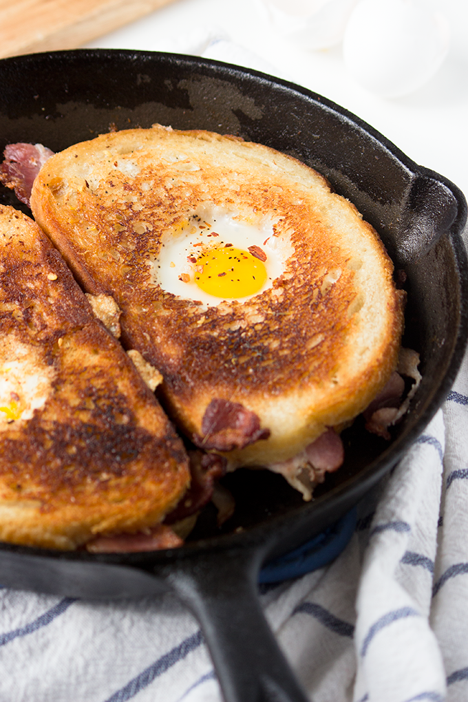 This recipe for Bacon Cheddar Grilled Cheese Egg in a Hole was so good that my boyfriend proposed to me - no joke! 